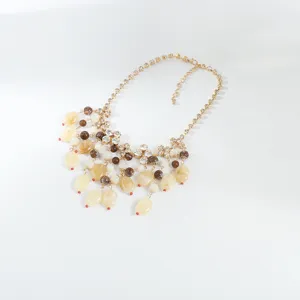 Exquisite statement necklace featuring rhinestone claw chains and colorful beaded tassels.