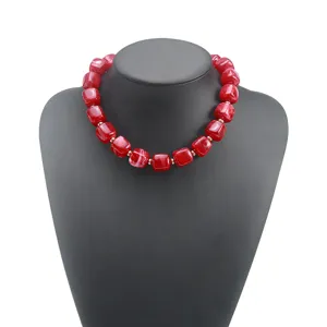 Red chunky acrylic beaded necklace statement jewelry piece for women fashion accessory.