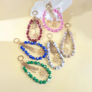 Portes-clés en perles acrylique colorées avec pendentifs soleil, élégants accessoires de sacs.