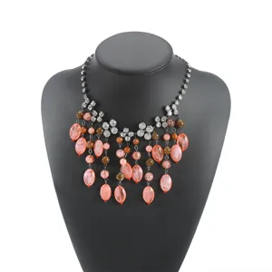 Detailed close-up view of trendy multi-layer peach bead tassel rhinestone chain necklace