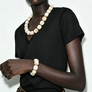 Chunky acrylic cylinder bead statement necklace and bracelet set bohemian fashion jewelry.