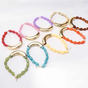 Detailed view of colorful resin bead necklaces with metallic curved tube elements for styling.