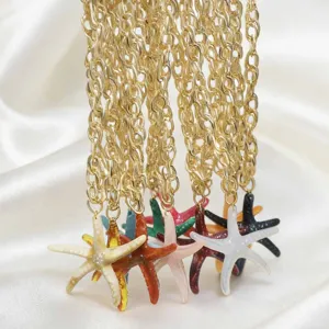 Detail view of colorful resin starfish pendant necklaces with shiny gold-tone chains, beach style.