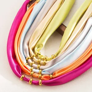 Multi-color fabric silk scarf necklace with chic golden metal ring beads elegant detail view