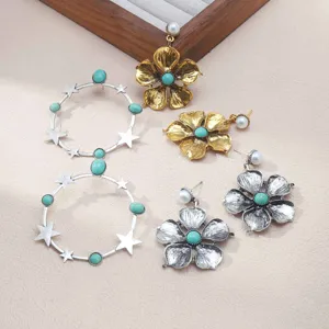 Retro turquoise flower and star hoop earrings set, vintage bohemian alloy jewelry detail.