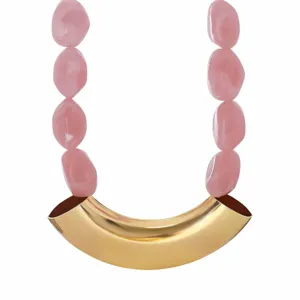 Chic statement choker necklace with pink resin beads and curved gold metal tube design.