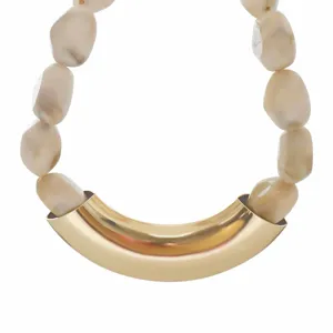 Chunky resin pebble and metallic tube statement necklace for women fashion styling.