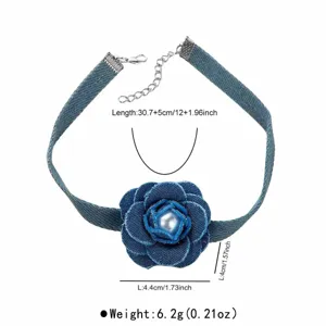 Denim flower choker necklace with pearl accent and adjustable length extension chain detail.