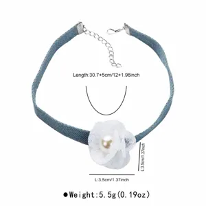 Denim choker necklace view highlighting the white fabric flower and pearl pendant.