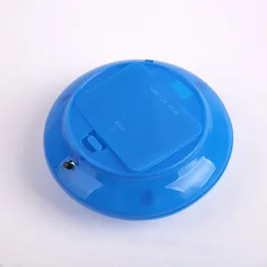 Detailed bottom view of the colorful flashing toy base, showing battery compartment and switch.