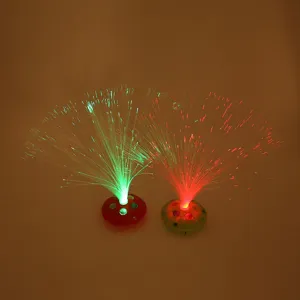 Detailed view of colorful flashing fiber optic night light toys with glowing fiber bundles.