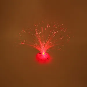 Close-up view of the glowing fiber optic lamp detail showing bright red radiating fiber light strands.