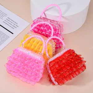 Grazioso borsetta giocattolo in pizzo luminoso per bambine, borsa da gioco colorata.
