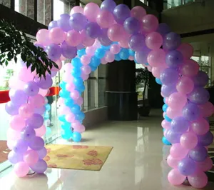 Pearlescent round balloons arranged in a stunning arch for wedding and party decor.