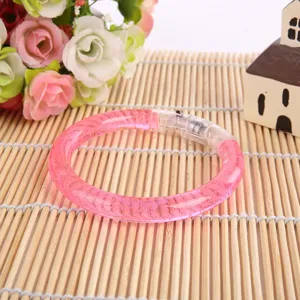 Pink LED glowing acrylic bracelet for kids night market toy party fashion accessory.