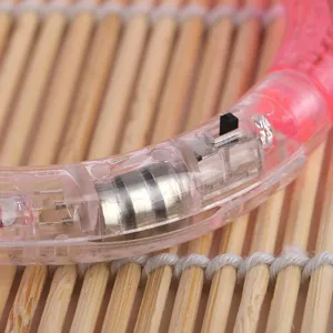 LED glowing toy bracelet acrylic light up bangle detail view with internal battery structure.