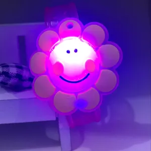 Silicone glowing cartoon flower bracelet detail shot, cute light up toy watch for kids.