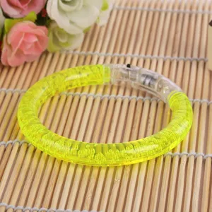 LED glowing acrylic bracelet toy, bright yellow flash bangle for kids party night market fun.