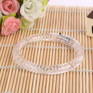 Clear acrylic LED light up glowing bracelet detail view with internal bubble texture design.