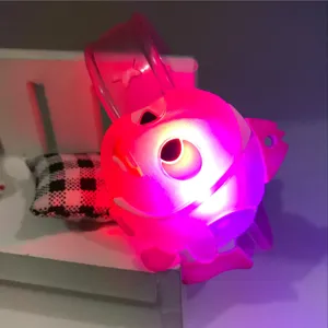 Close-up detail of the glowing cartoon character silicone slap bracelet toy with bright LED light.