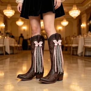 Brown western cowboy boots with cute pink bow, lace and pearl tassel charms for women.