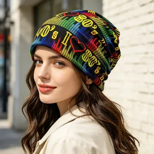 Close-up detail shot of a retro 80s style colorful knitted beanie with wave pattern.