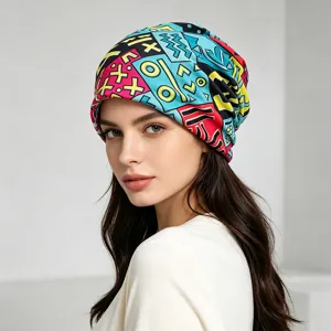Close-up detail of the colorful geometric print slouchy beanie hat, soft knit fabric texture.