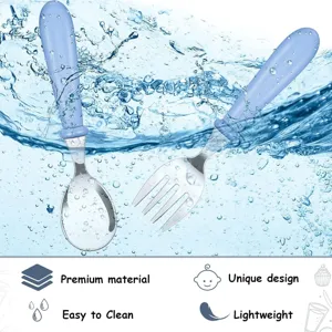 Stainless steel baby spoon and fork set with candy color handles in water splash background