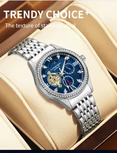 Detail shot of the automatic mechanical watch featuring a blue skeleton dial and rhinestone bezel.