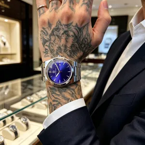 Business men quartz watch featuring blue sunburst dial and metal strap with calendar