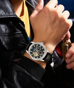 Men automatic mechanical watch with black leather strap, rhinestone bezel, and hollow dial.