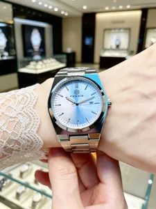 Men's classic stainless steel watch with gradient blue dial and luminous hands for daily wear.