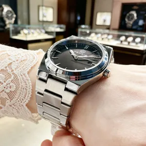 Men's stainless steel quartz watch with dark dial, sleek integrated bracelet and minimalist indices.