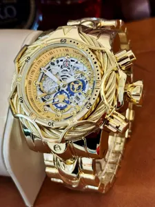 Gold tone steampunk chronograph mens watch featuring cable bezel and large dial in stainless steel