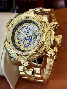 Golden heavy duty punk mechanical watch detail, cable wire bezel and large dial chronograph.
