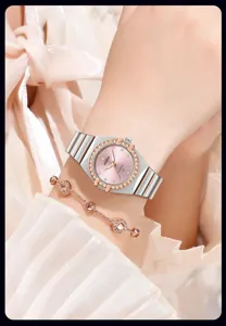 Elegant women's quartz watch with pink dial, crystal bezel, and two-tone stainless steel strap.