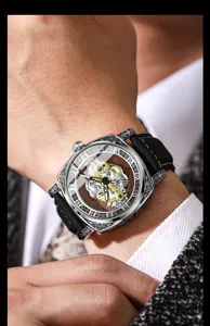 Detailed close-up shot of a men's automatic mechanical skeleton watch with intricate carved case.