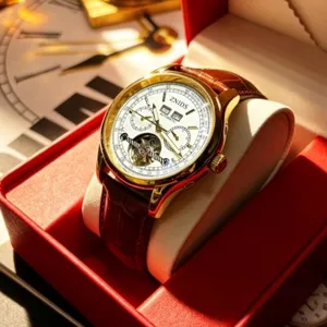 Men's luxury automatic mechanical watch with gold case, white dial, and brown leather strap.