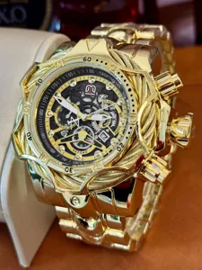 Gold-tone luxury men wrist watch detail, large punk style steel wire bezel chronograph dial.