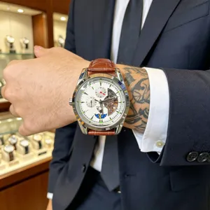 Detailed close-up shot of the mechanical wristwatch worn on the wrist, highlighting dial.