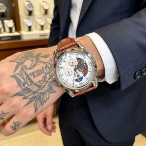 Men's mechanical watch with automatic movement, leather strap, and elegant dial design.