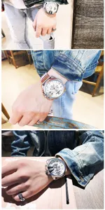 Detailed close-up shot of a men's oversized chronograph watch worn on wrist with street style.