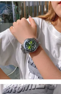 Stylish men quartz watch featuring green gradient dial and ornate carved metal bezel and strap.