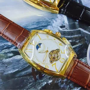 Automatic mechanical men's watch with tonneau gold case, tourbillon, moon phase, and leather strap.