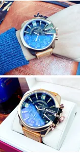 Oversized men quartz watch with blue dial, brown leather strap, and unique crown guard.