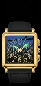 Close-up of square quartz watch dial with luminous hands, gold tone case, detailed numerals.