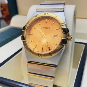 Luxus Gold Silber Quarzuhr mit römischen Ziffern Datumsanzeige für Paare modische Armbanduhr.