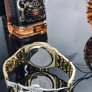 Close-up detail view of luxury men quartz watch back featuring carved metal steel band.