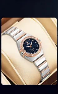 Elegantly designed women quartz watch featuring a starry dial, crystal bezel and two-tone steel strap.