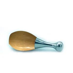 Stainless steel and wood facial massager tool for eye and face Gua Sha care main.